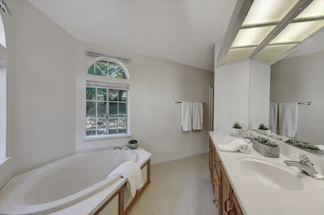 a bathroom with a glass shower door