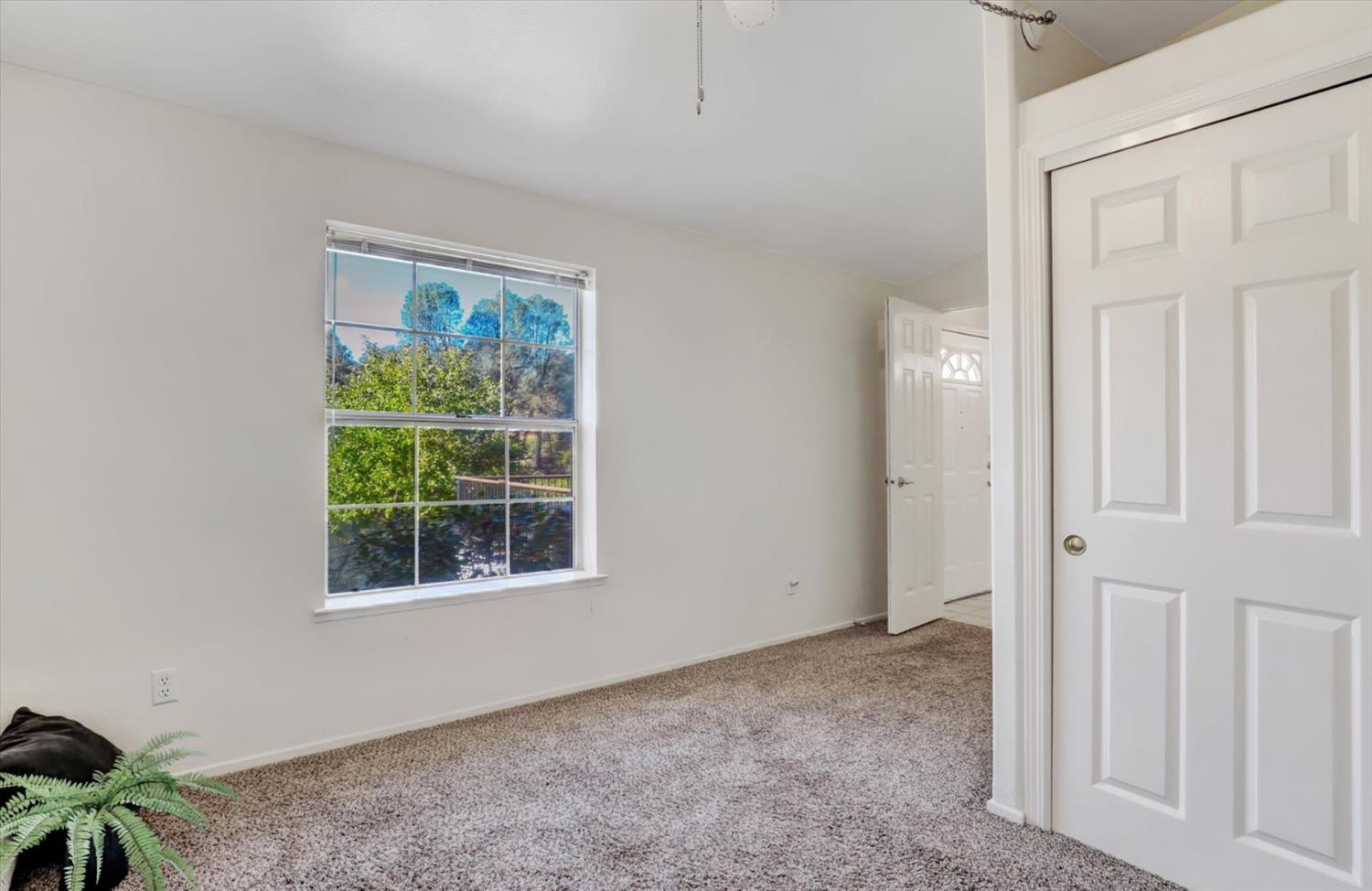 16260 Hillaire Road Rough and Ready, CA 95975 - Photo 18 of 45 an empty room with windows and closet