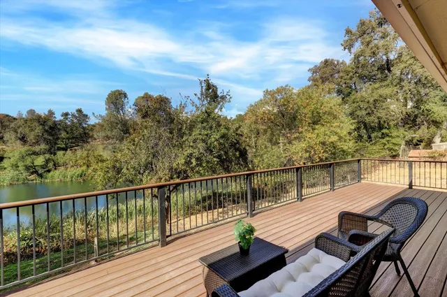 a view of a balcony with wooden fence
