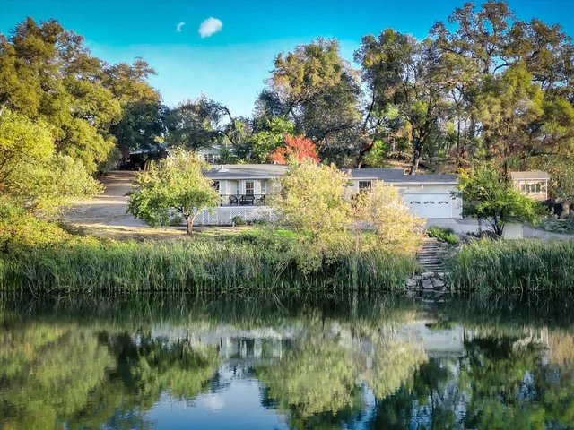 a view of livingroom with furniture and chandelier fan