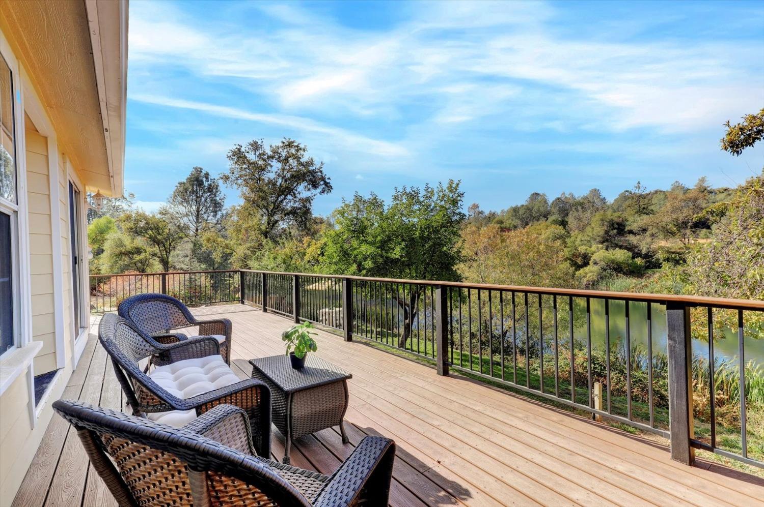 16260 Hillaire Road Rough and Ready, CA 95975 - Photo 21 of 45 a view of a balcony with wooden floor and outdoor seating