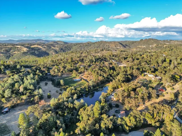 a view of house with a chairs in patio