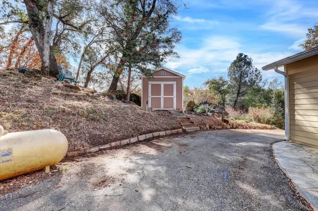 a view of a lake with a bench in roof