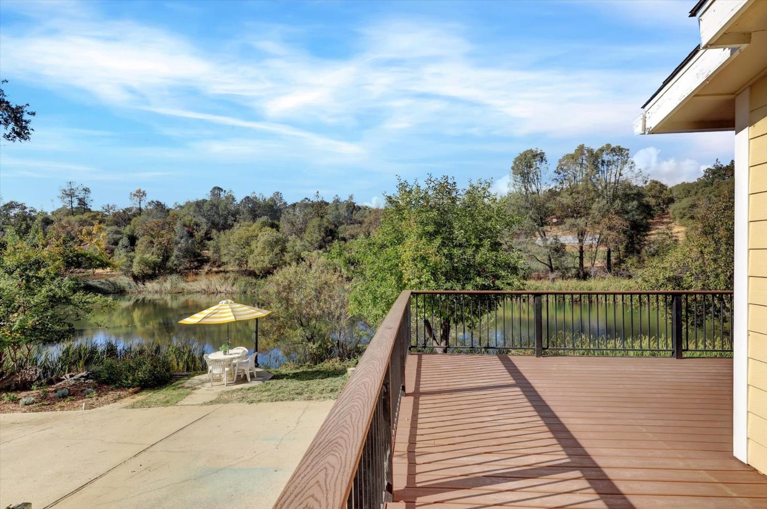 16260 Hillaire Road Rough and Ready, CA 95975 - Photo 42 of 45 a view of a balcony with wooden floor and fence