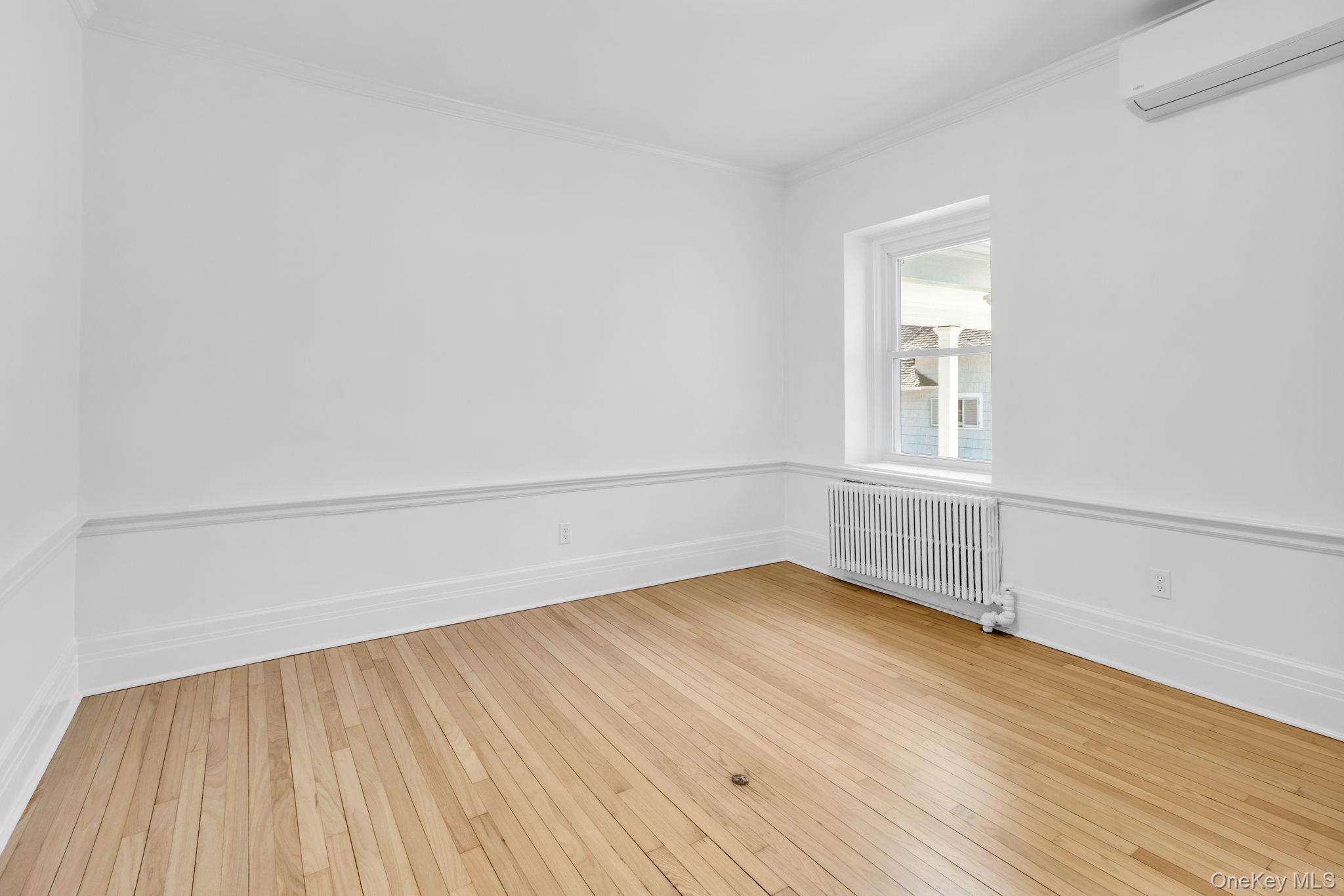 475 Dobbs Ferry Road White Plains, NY 10607 - Photo 14 of 29 wooden floor in an empty room with a window