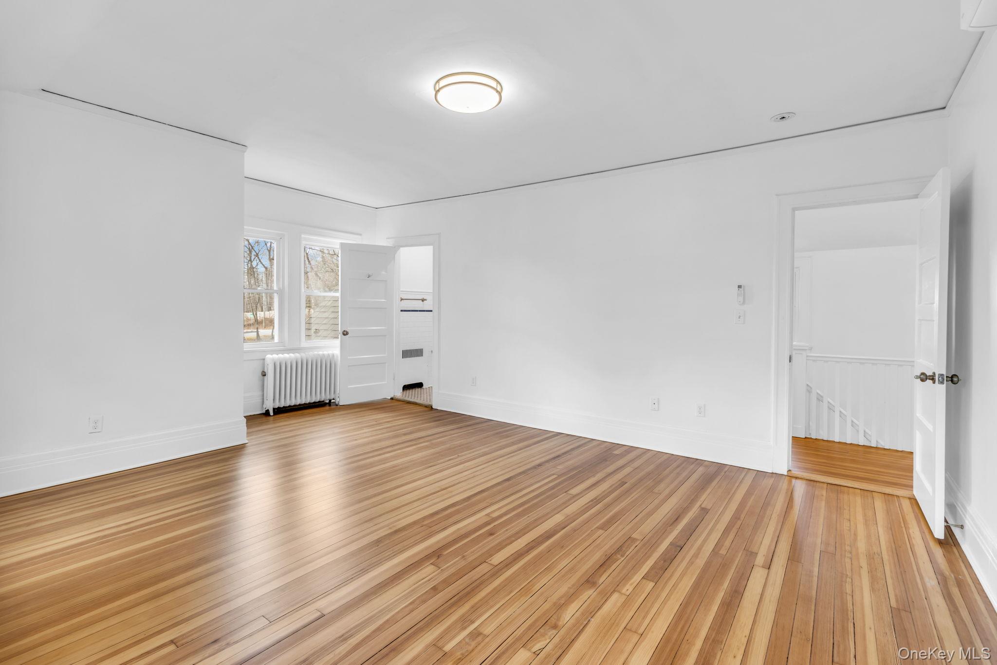 475 Dobbs Ferry Road White Plains, NY 10607 - Photo 21 of 29 a view of empty room with wooden floor and fan