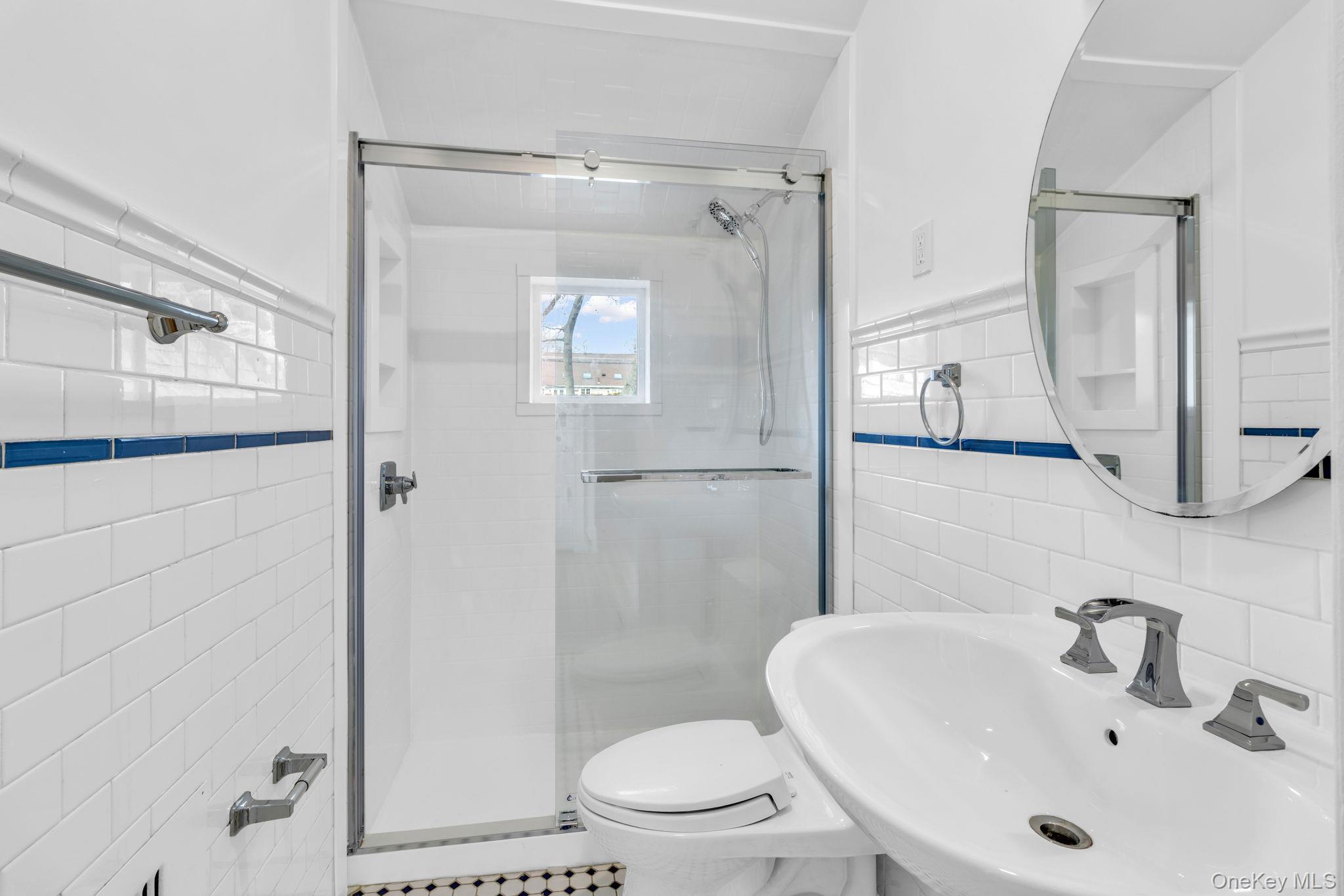 475 Dobbs Ferry Road White Plains, NY 10607 - Photo 24 of 29 a bathroom with a sink a toilet and shower