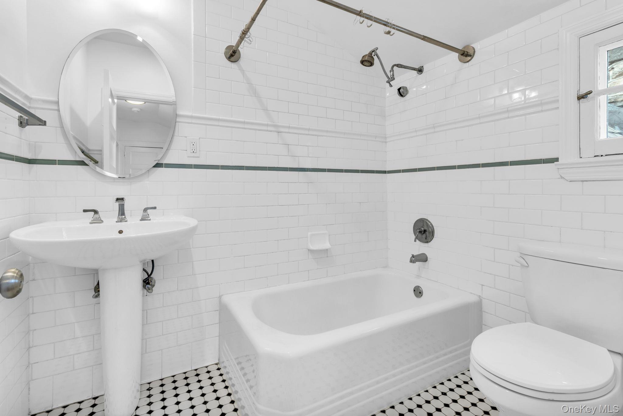 475 Dobbs Ferry Road White Plains, NY 10607 - Photo 29 of 29 a bathroom with a sink a toilet and shower