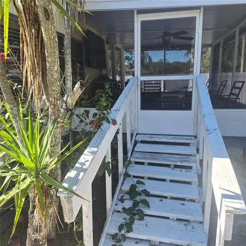 a view of a room with a window and balcony