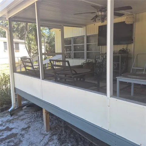 a view of a porch with a yard