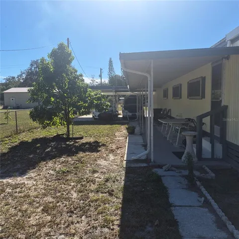 a view of backyard porch and garden