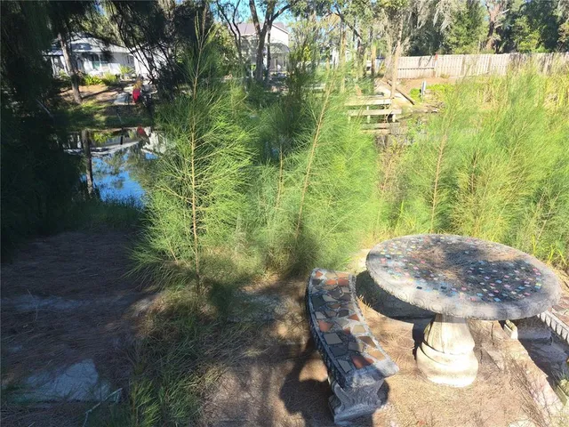 a view of a lake with a yard