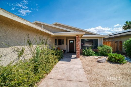 313 East Haloid Avenue Ridgecrest, CA 93555 - Photo 35 of 39 a view of a house with potted plants