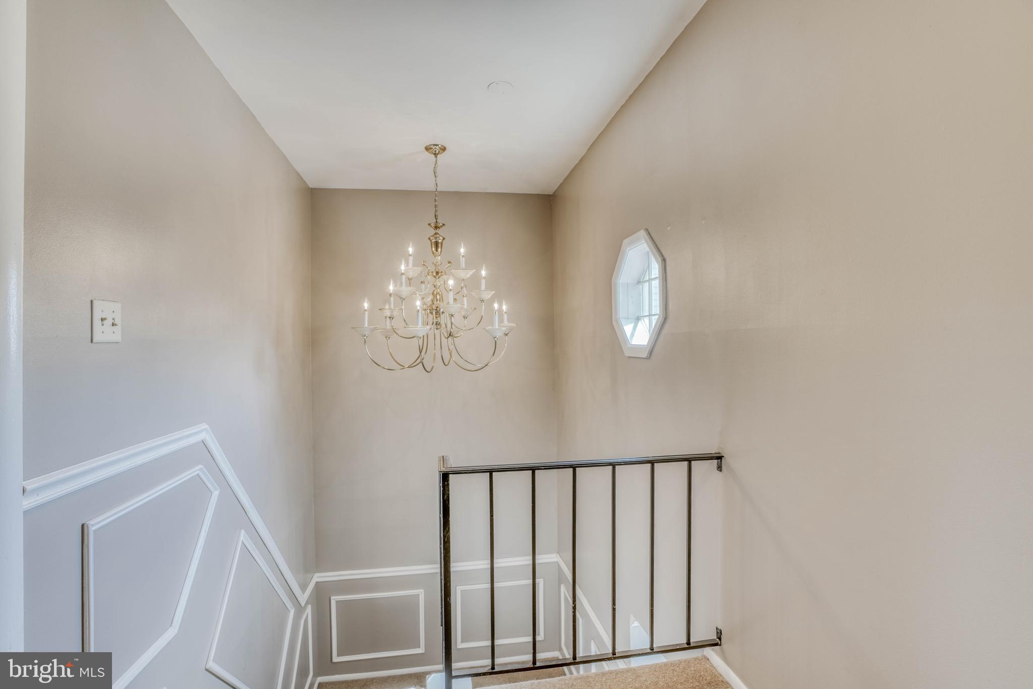 8605 Heathermill Road Baltimore, MD 21236 - Photo 30 of 50 UL - The hall w/ a beautiful chandelier