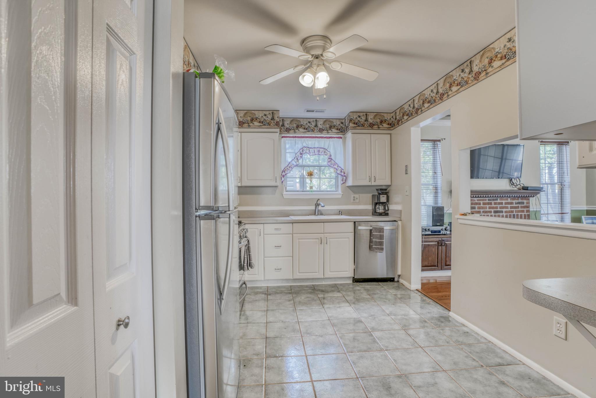 8605 Heathermill Road Baltimore, MD 21236 - Photo 5 of 50 Kitchen - On your left the pantry and fan ceiling