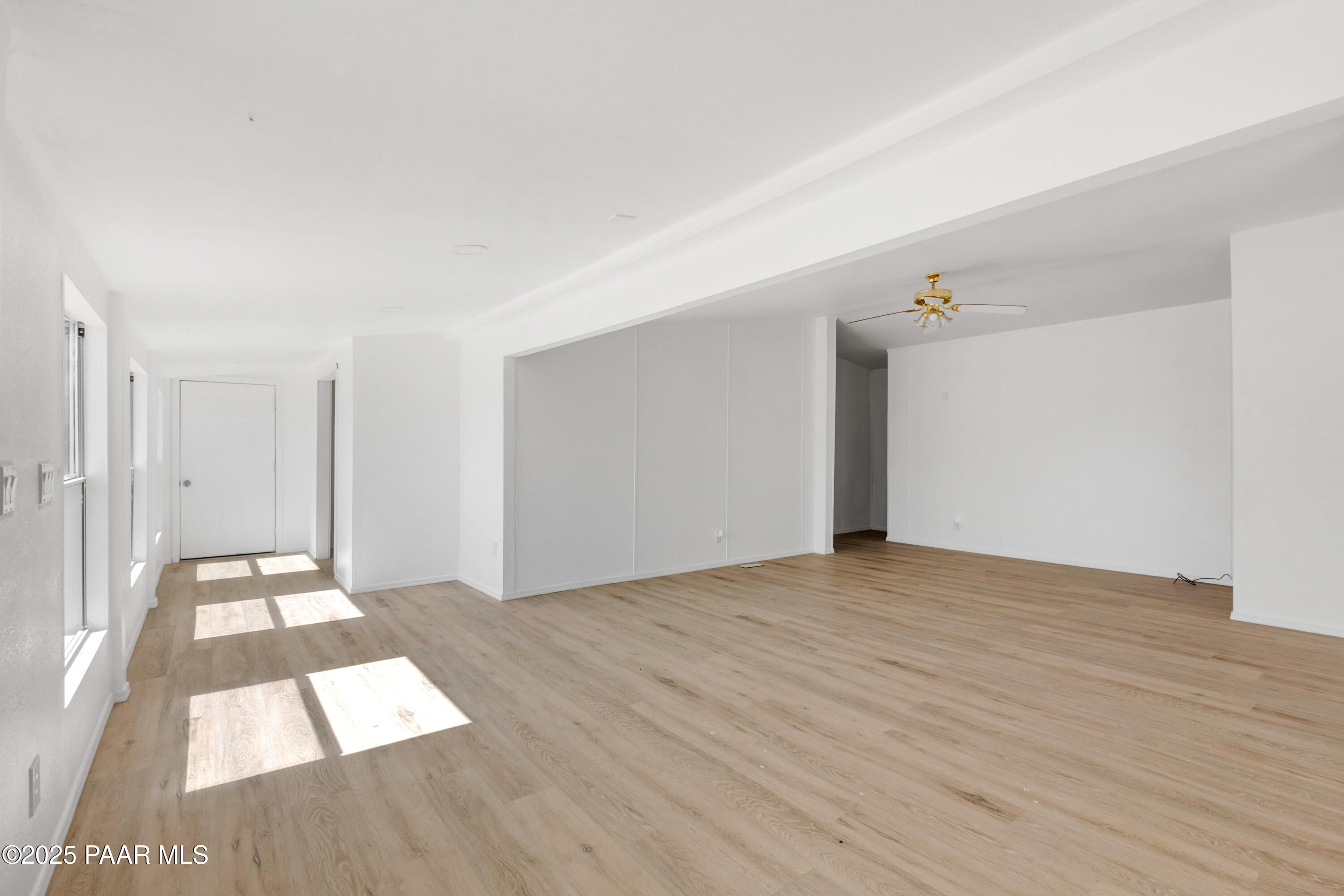 17841 East Willow Creek Road Kingman, AZ 86401 - Photo 2 of 73 a view of an empty room and wooden floor
