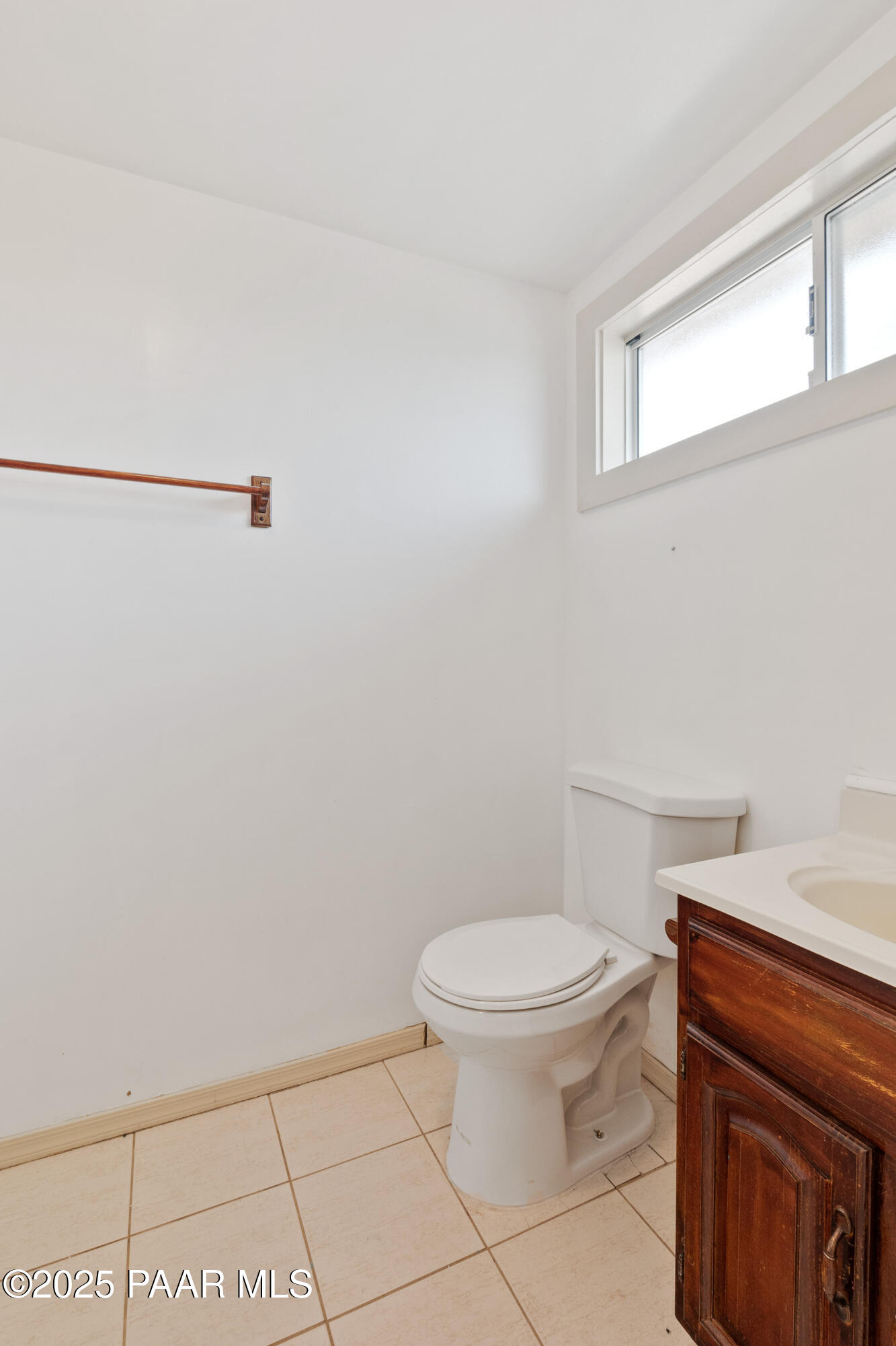 17841 East Willow Creek Road Kingman, AZ 86401 - Photo 45 of 73 a white toilet sitting next to a bathroom sink