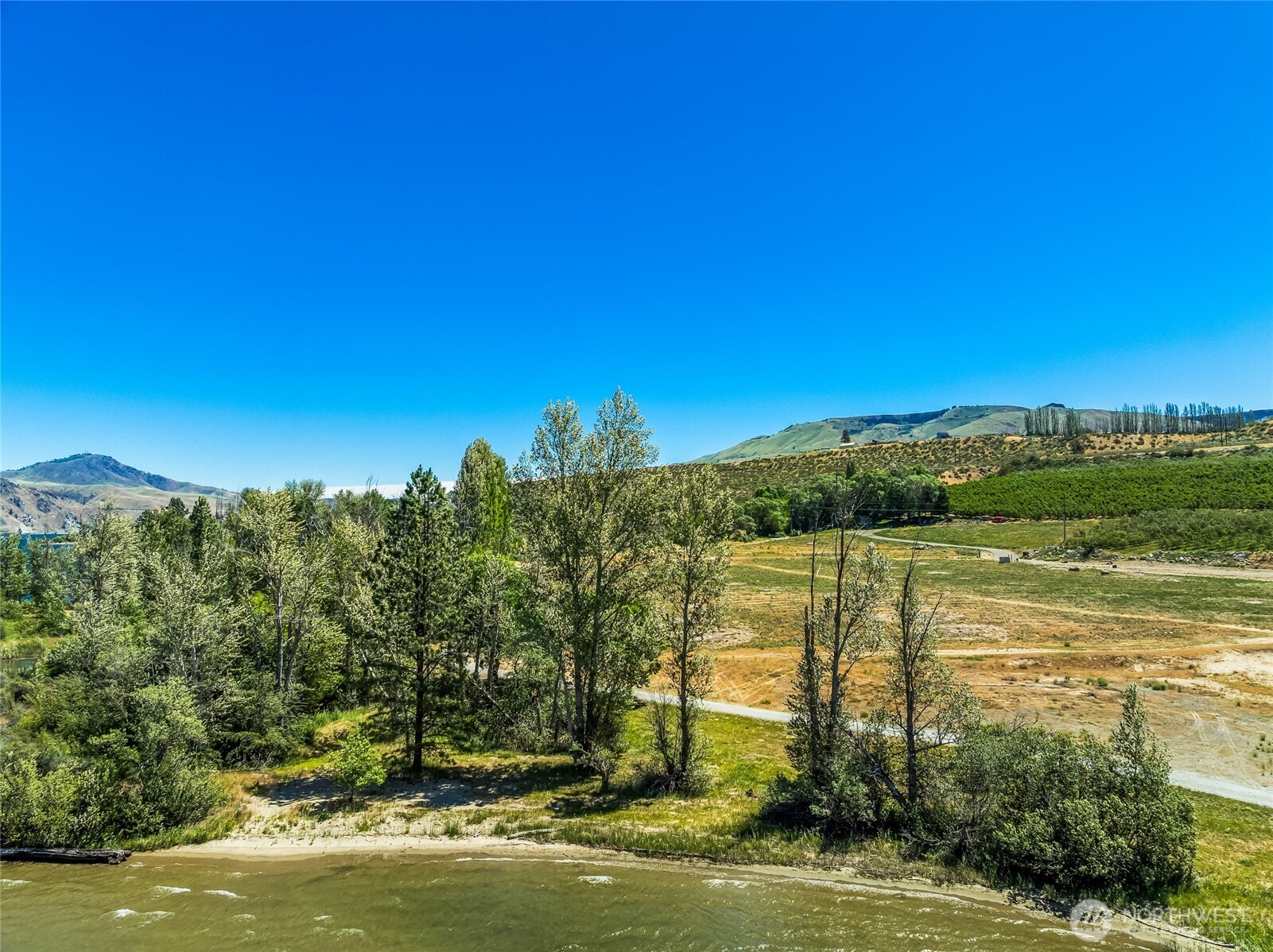0 Lot 5 Silvest Road Orondo, WA 98843 - Photo 12 of 17 a view of a lake with a big yard
