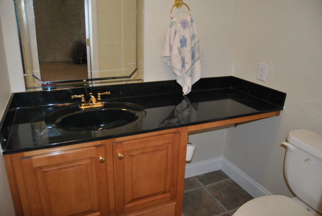 377 Wheeler Road Gray, GA 31032 - Photo 12 of 45 a bathroom with a sink and a mirror