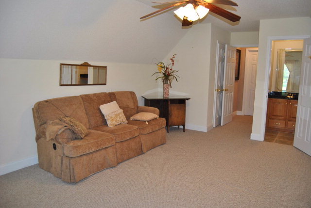 377 Wheeler Road Gray, GA 31032 - Photo 13 of 45 a living room with furniture and a chandelier