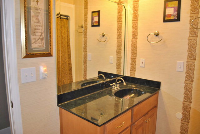 377 Wheeler Road Gray, GA 31032 - Photo 20 of 45 a bathroom with a sink and a mirror