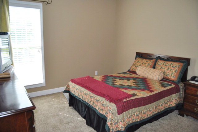 377 Wheeler Road Gray, GA 31032 - Photo 21 of 45 a bedroom with a bed and a window
