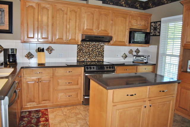 377 Wheeler Road Gray, GA 31032 - Photo 25 of 45 a kitchen with granite countertop cabinets and window