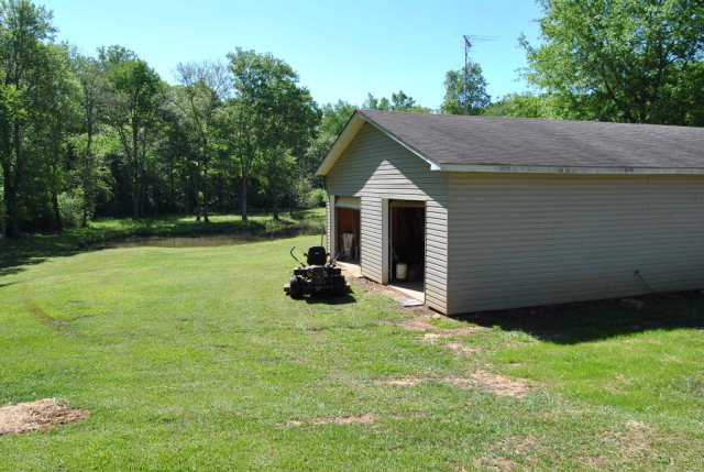 377 Wheeler Road Gray, GA 31032 - Photo 39 of 45 a view of a backyard with table and chairs and a yard