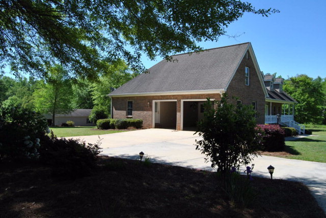 377 Wheeler Road Gray, GA 31032 - Photo 44 of 45 a front view of house with yard and trees in the background