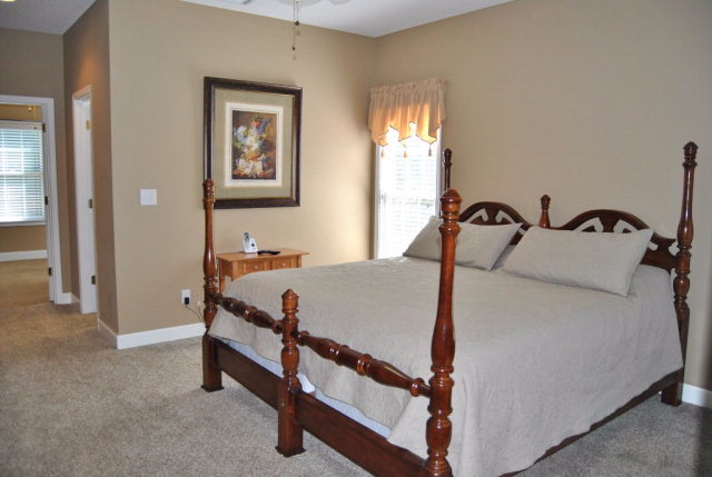 377 Wheeler Road Gray, GA 31032 - Photo 6 of 45 a bed sitting in a bedroom next to a window