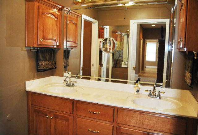 377 Wheeler Road Gray, GA 31032 - Photo 9 of 45 a bathroom with a double vanity sink and a mirror