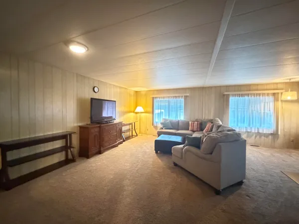 a view of a kitchen with a sink and a large window