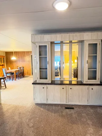 a workspace with furniture and a chandelier