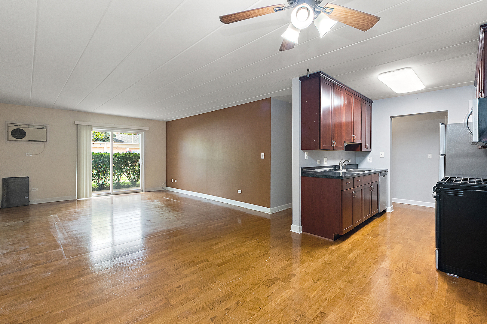 1000 South Lorraine Road, Unit 110 Wheaton, IL 60189 - Photo 12 of 29 a view of kitchen with window and wooden floor