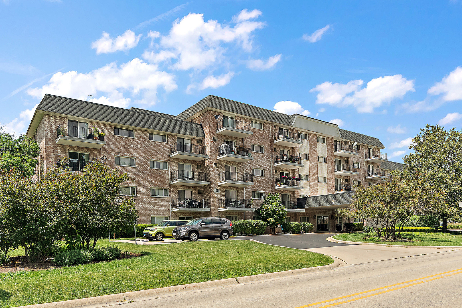1000 South Lorraine Road, Unit 110 Wheaton, IL 60189 - Photo 2 of 29 a large building with a view of a building in the background