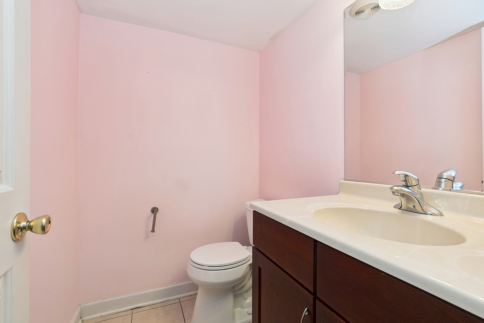 1000 South Lorraine Road, Unit 110 Wheaton, IL 60189 - Photo 21 of 29 a bathroom with a sink a toilet and mirror