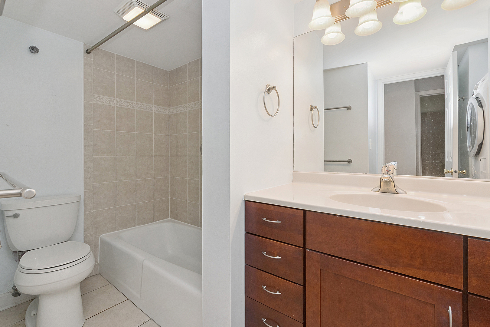 1000 South Lorraine Road, Unit 110 Wheaton, IL 60189 - Photo 23 of 29 a bathroom with a sink a toilet and shower