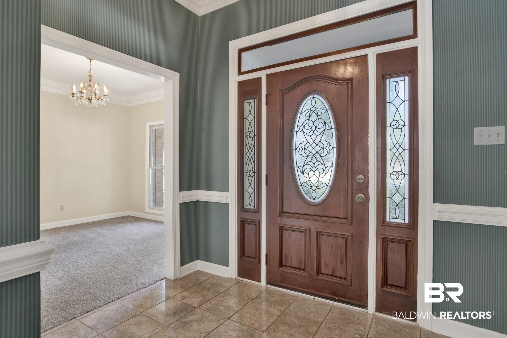 6805 Hunters Court Mobile, AL 36695 - Photo 5 of 37 Carpeted entrance foyer featuring a chandelier, crown molding, and baseboards