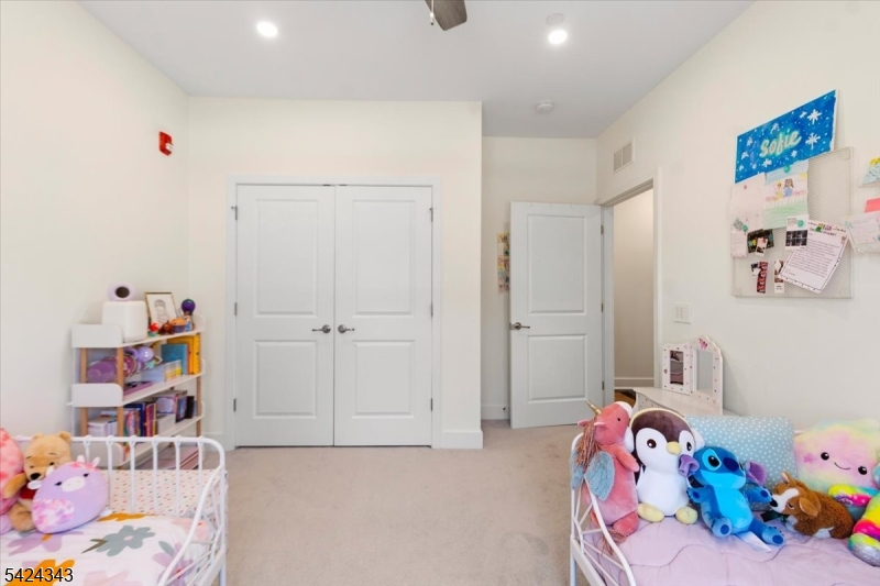 11 Veterans Way, Unit 111 Morris Plains, NJ 07950 - Photo 12 of 21 a bedroom with a bed and a closet