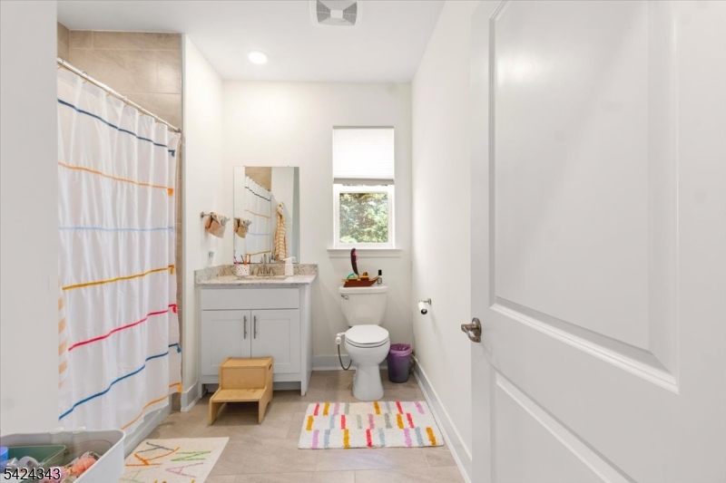 11 Veterans Way, Unit 111 Morris Plains, NJ 07950 - Photo 15 of 21 a bathroom with a sink toilet and shower