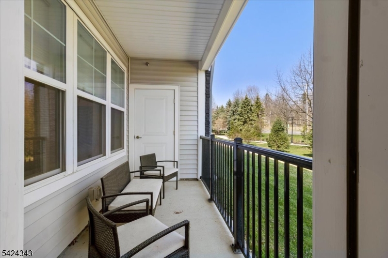11 Veterans Way, Unit 111 Morris Plains, NJ 07950 - Photo 20 of 21 a view of a balcony with chairs