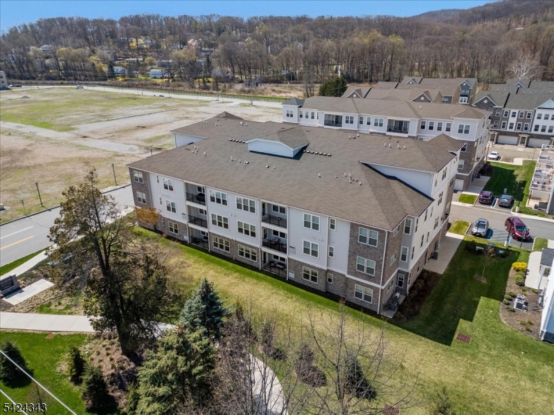 11 Veterans Way, Unit 111 Morris Plains, NJ 07950 - Photo 3 of 21 an aerial view of residential houses with outdoor space and river