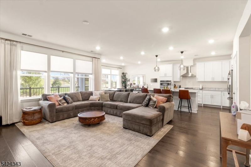 11 Veterans Way, Unit 111 Morris Plains, NJ 07950 - Photo 5 of 21 a living room with furniture and a large window