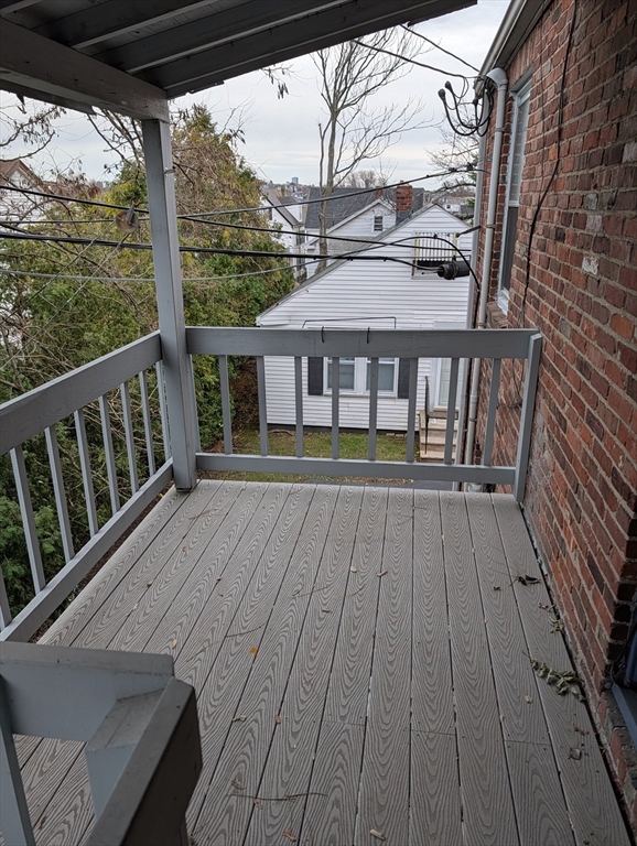 260 Main Street, Unit 12 Medford, MA 02155 - Photo 8 of 10 a view of a balcony with wooden floor