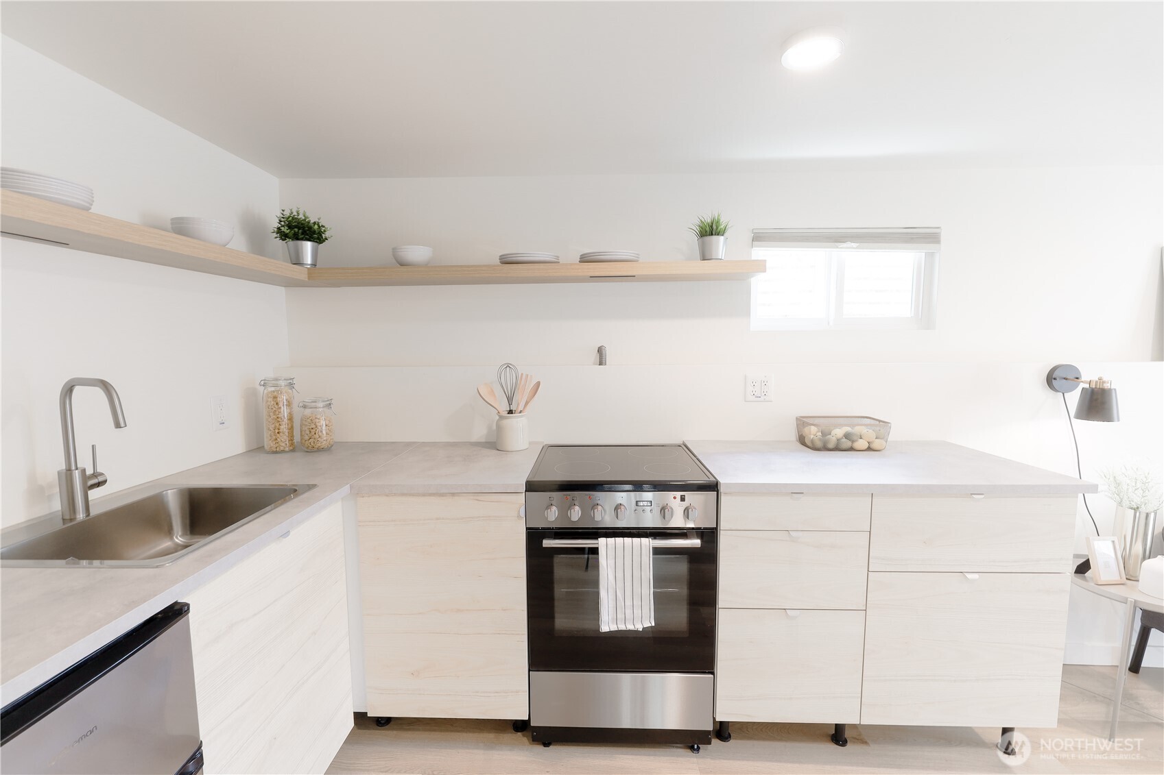 6012 40th Avenue Northeast Seattle, WA 98115 - Photo 22 of 28 a kitchen with a stove and cabinets