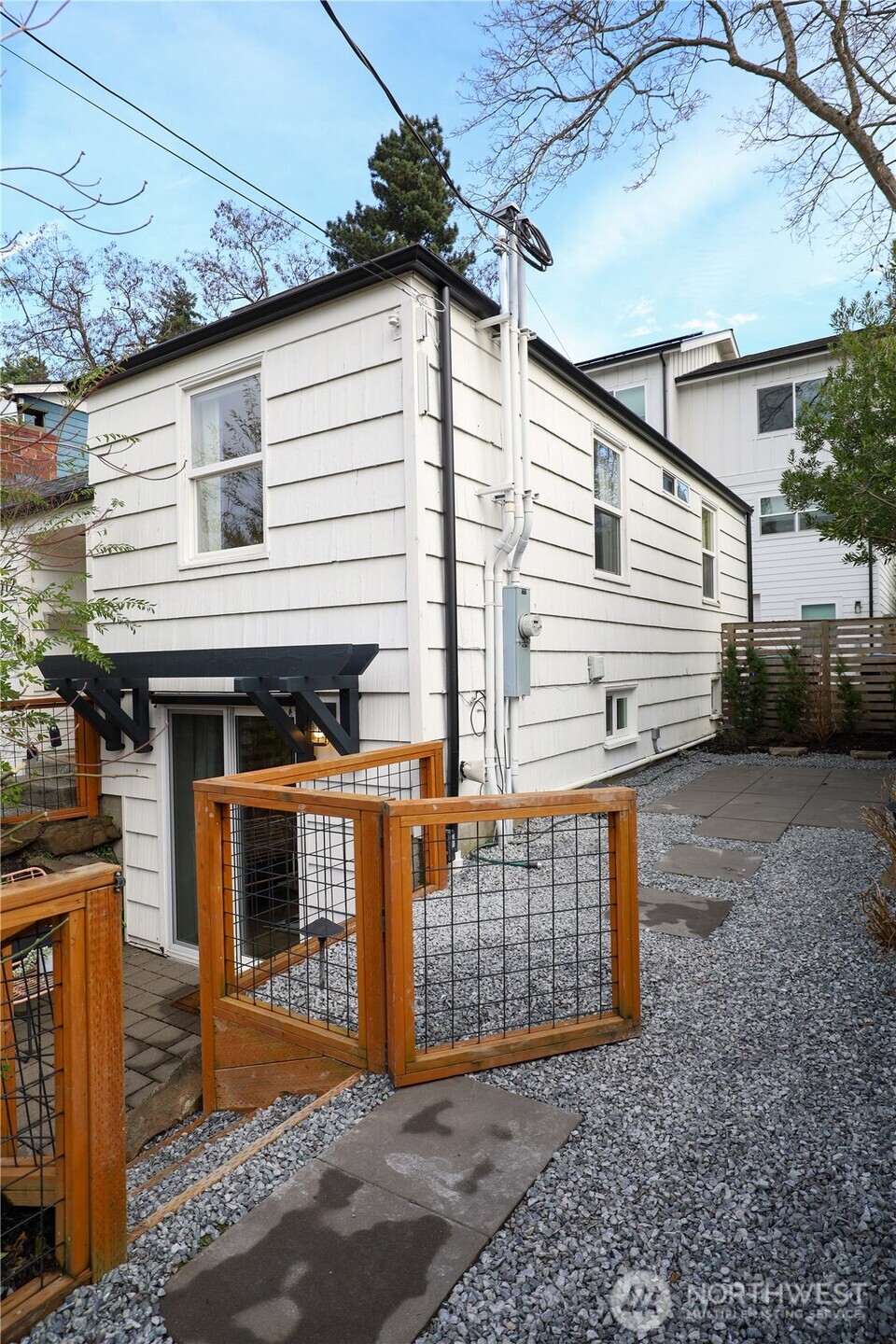 6012 40th Avenue Northeast Seattle, WA 98115 - Photo 26 of 28 a view of a house with a yard and garage