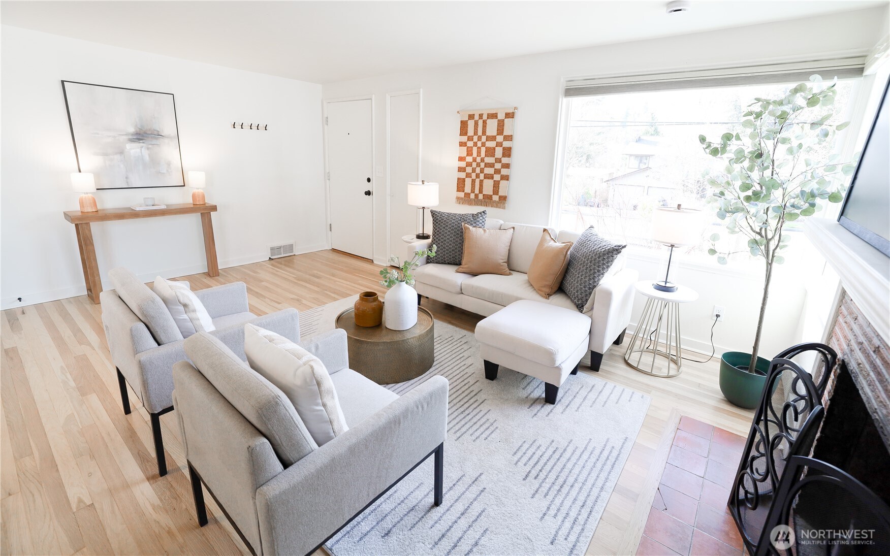 6012 40th Avenue Northeast Seattle, WA 98115 - Photo 4 of 28 a living room with furniture a rug and a window