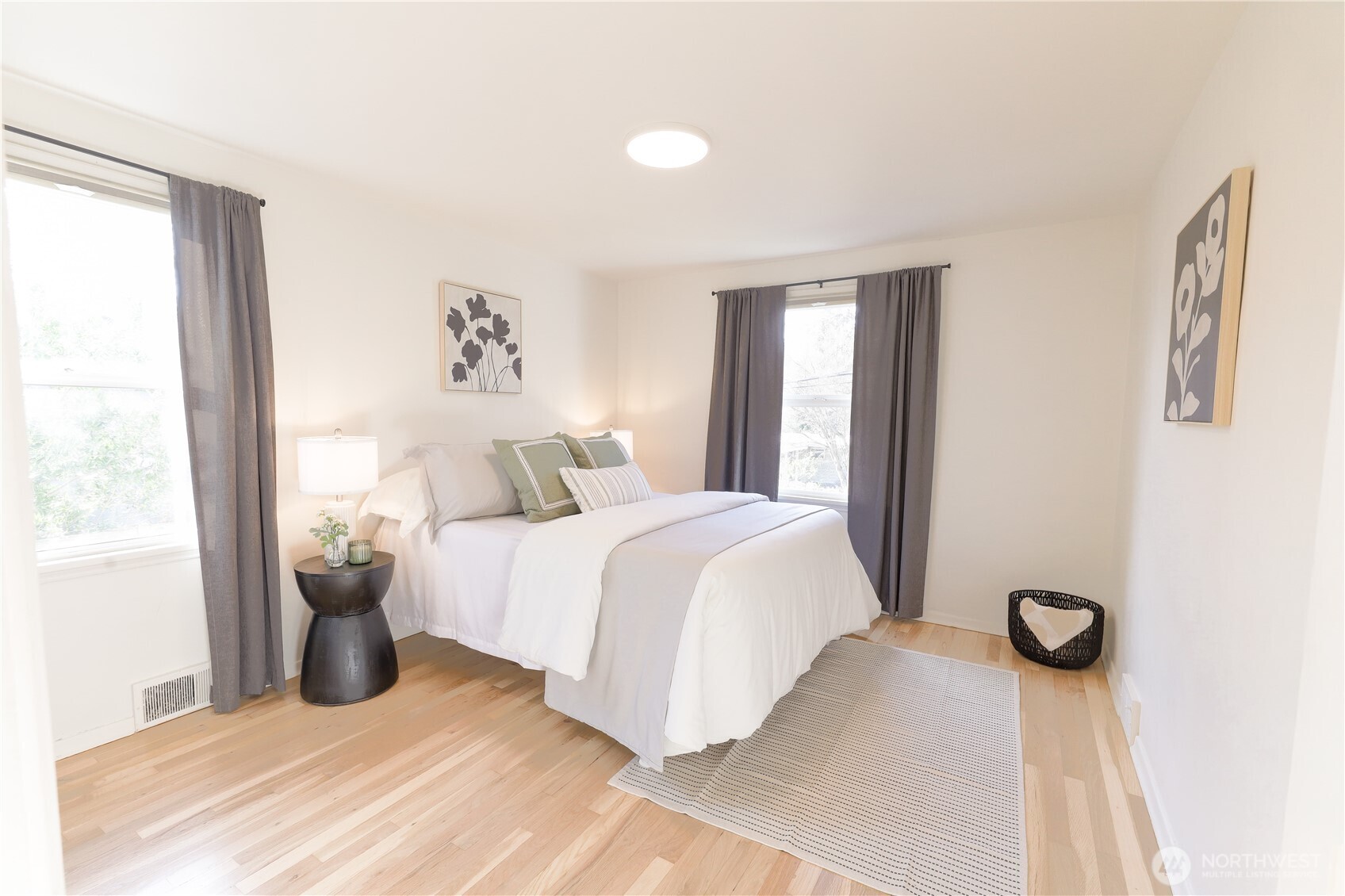 6012 40th Avenue Northeast Seattle, WA 98115 - Photo 8 of 28 a bedroom with a bed and window