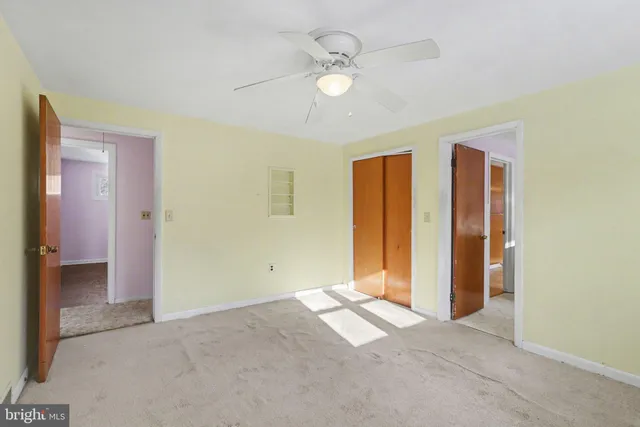 a view of livingroom with hardwood floor and ceiling fan