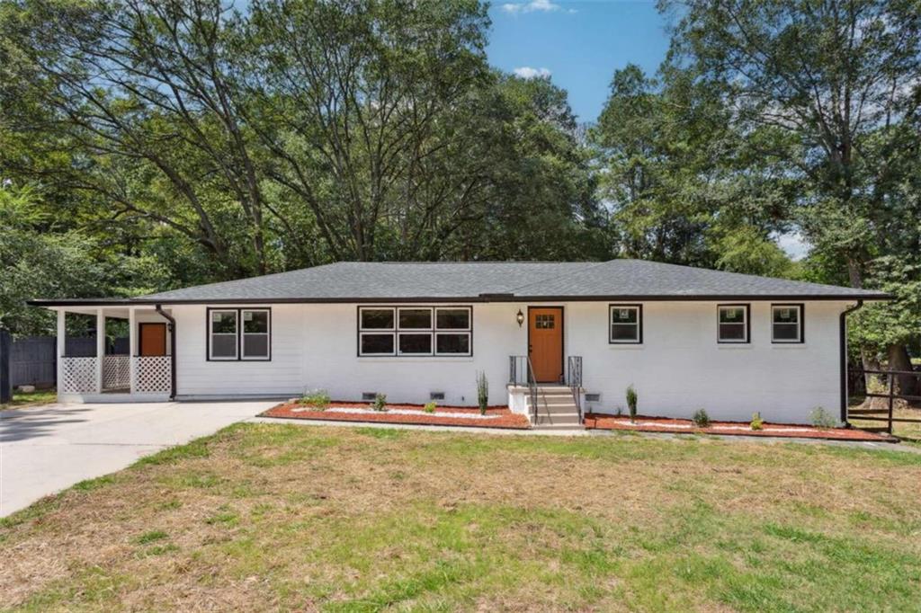 a house that has tree in front of it
